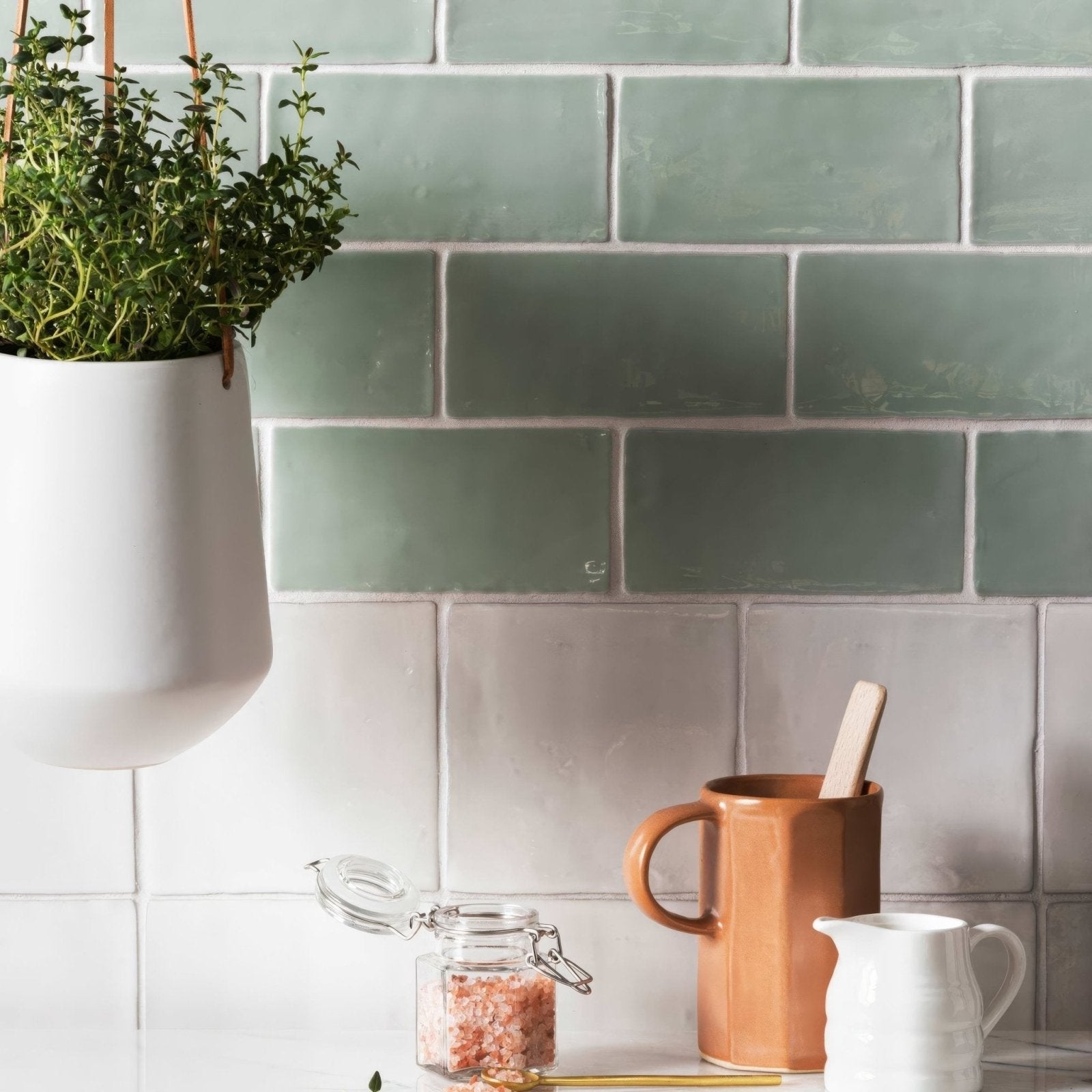 Forecast arran square glazed tile in matte muted sage green with subtle texture and white grout lines backsplash