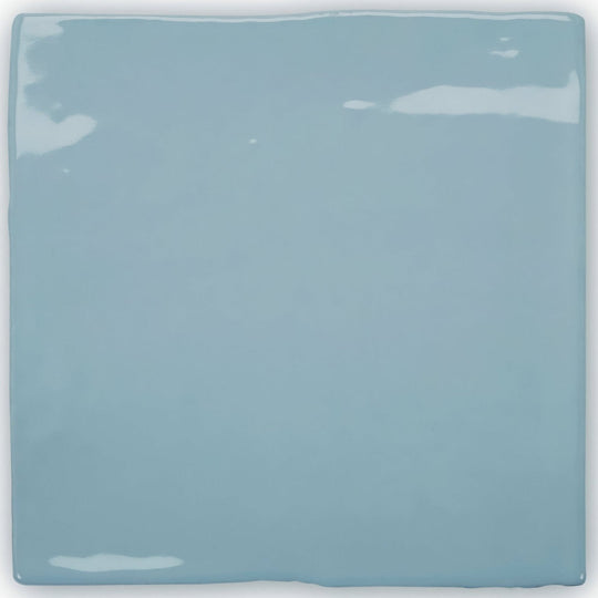 A square glossy light blue ceramic tile with slightly uneven edges from forecast forth square glazed tile collection