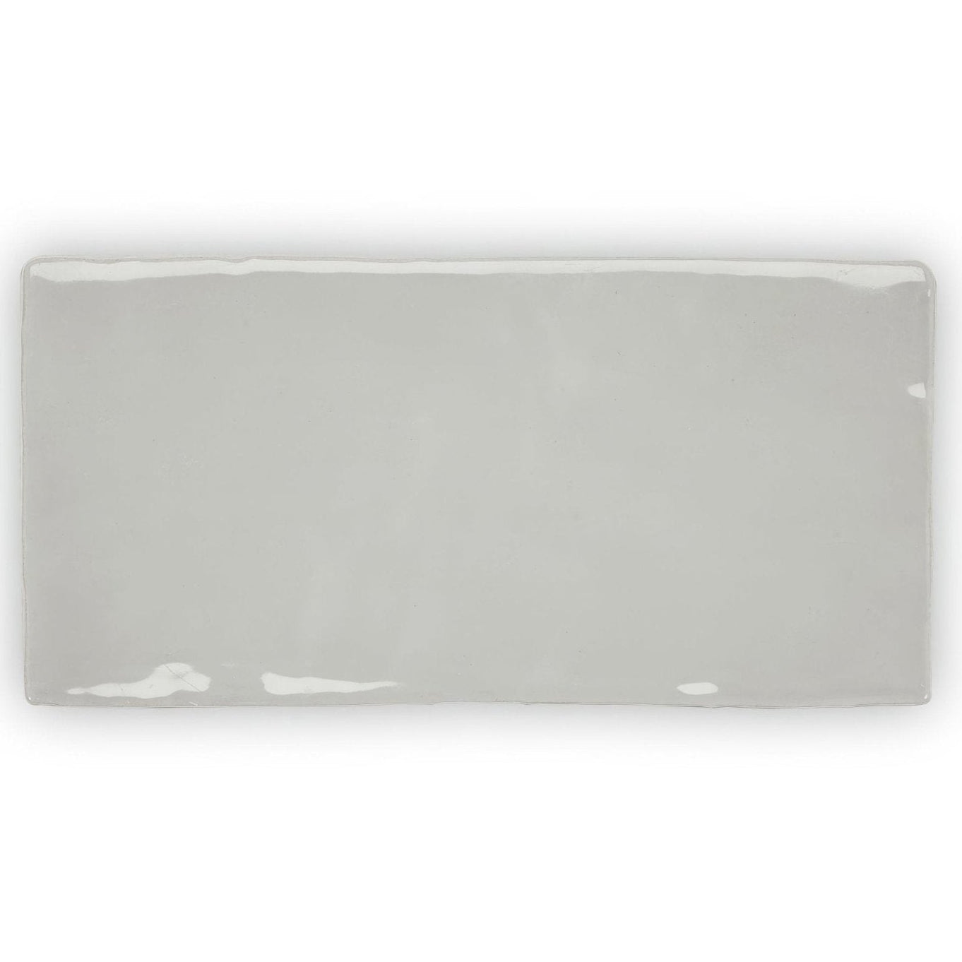 A sleek rectangular ceramic tile forecast Portland rectangle glazed tile with smooth gray finish and white glaze accents