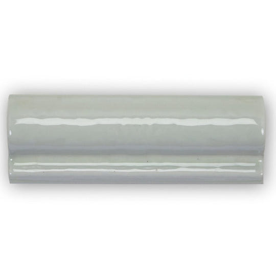 A sleek light gray Forecast Rockall glazed dado ceramic tile with smooth curved edges and subtle reflective highlights