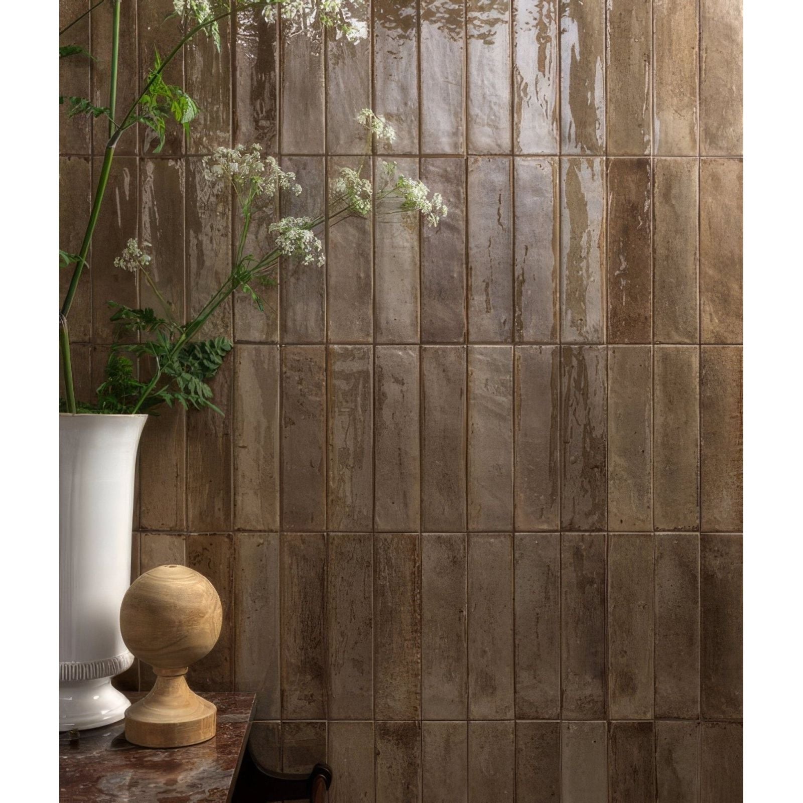 Brown glossy ceramic tiles with rustic handcrafted finish from foundry novo porcelain beige collection