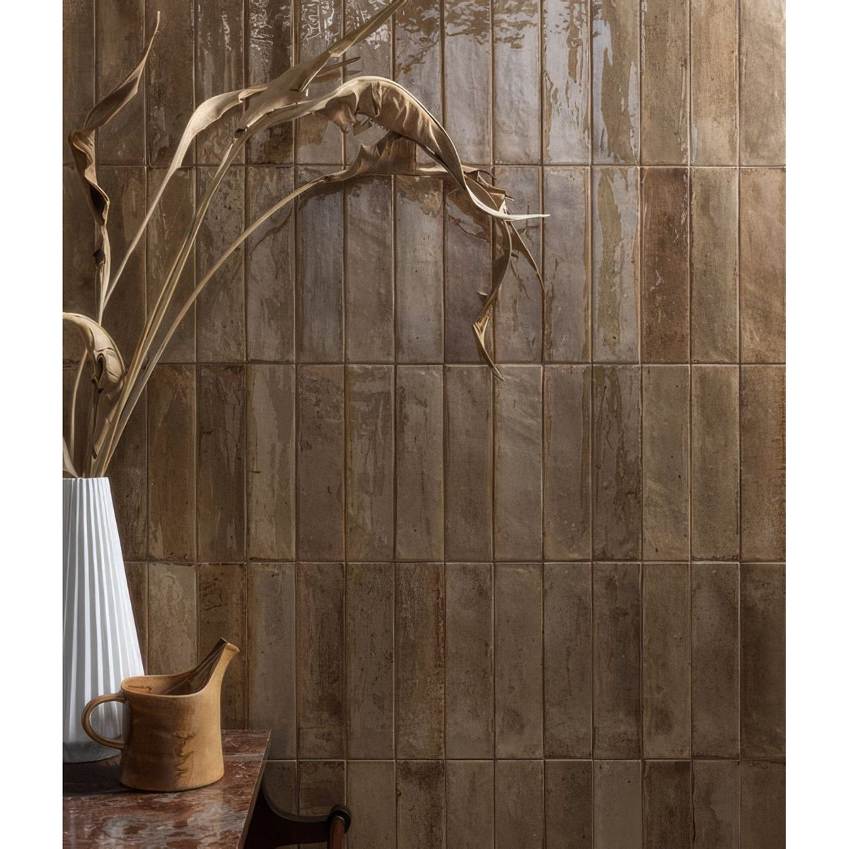 Earthy-toned textured porcelain tiles with a rustic weathered finish in beige foundry novo porcelain beige design