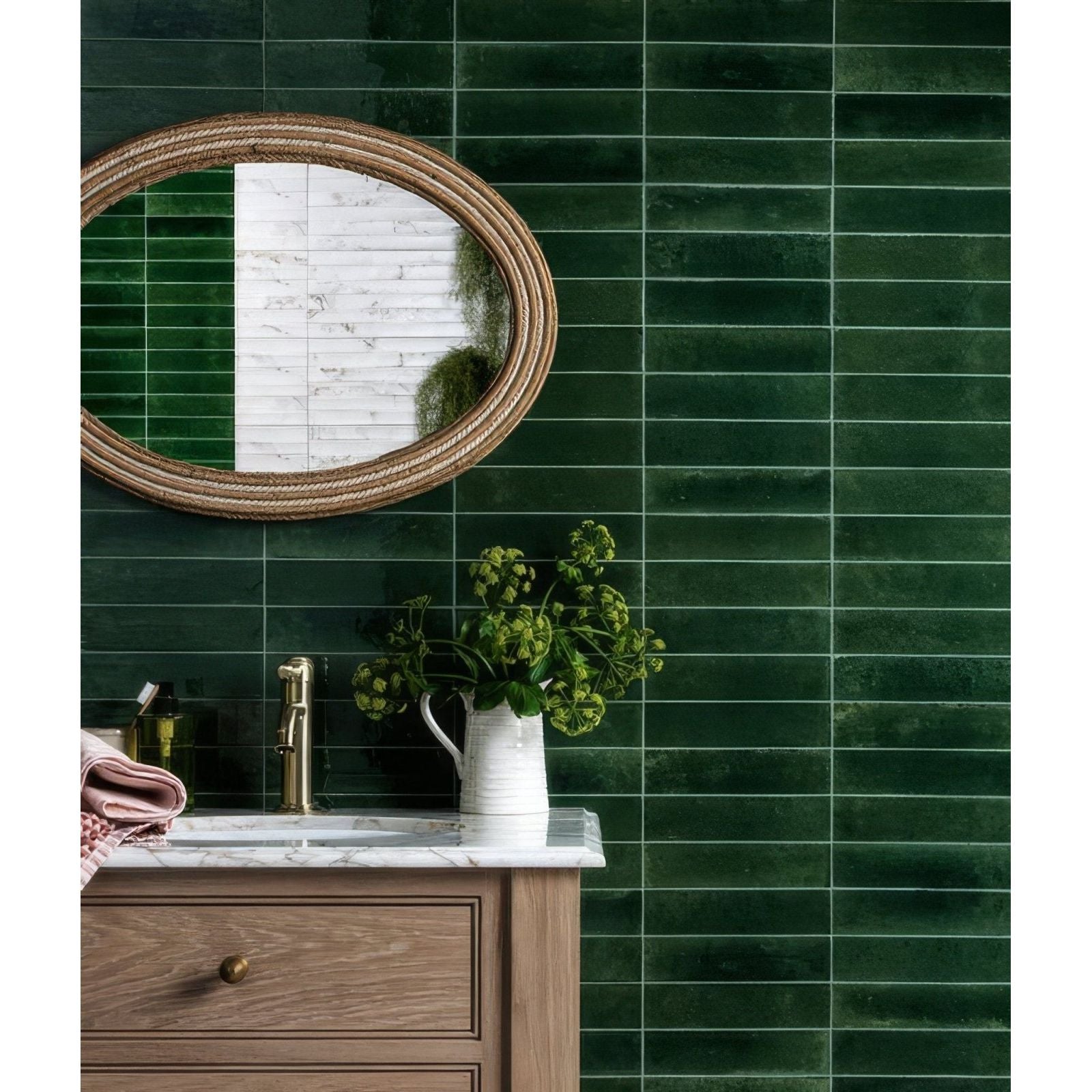 Dark green glossy rectangular ceramic tiles covering a wall from the foundry novo porcelain irish green collection