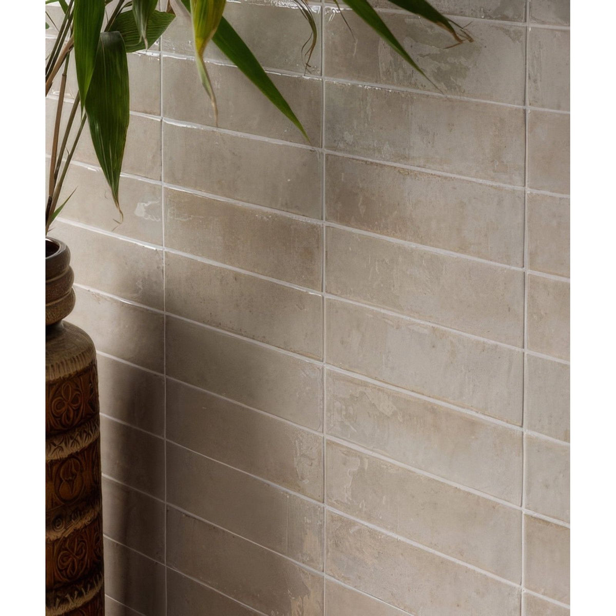 Beige rectangular foundry novo porcelain linen tiles with subtle texture and glossy finish arranged horizontally