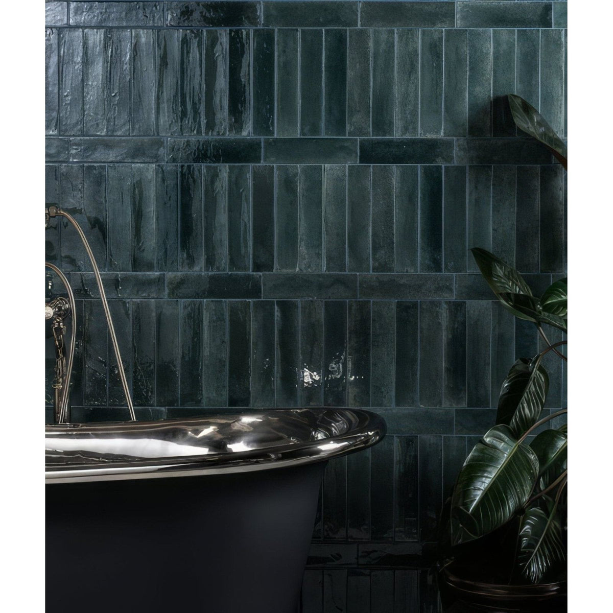 Foundry novo porcelain navy dark green glossy textured rectangular tiles behind black clawfoot bathtub wall panel