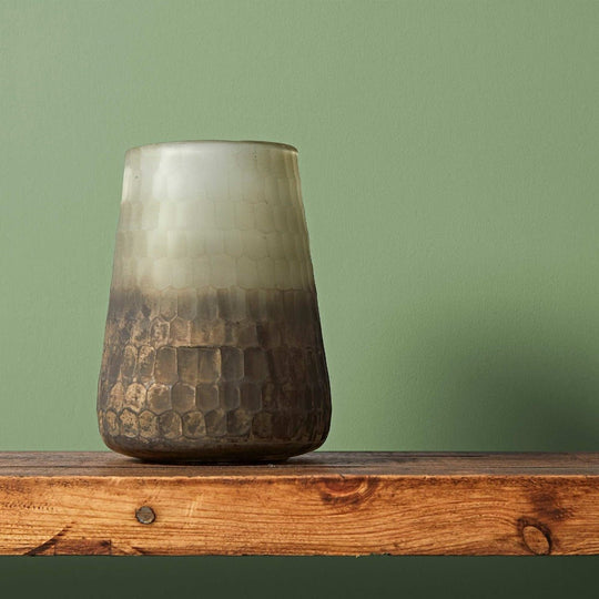 Garnet ceramic vase with a gradient light gray to dark brown finish and a textured hammered pattern on the lower half