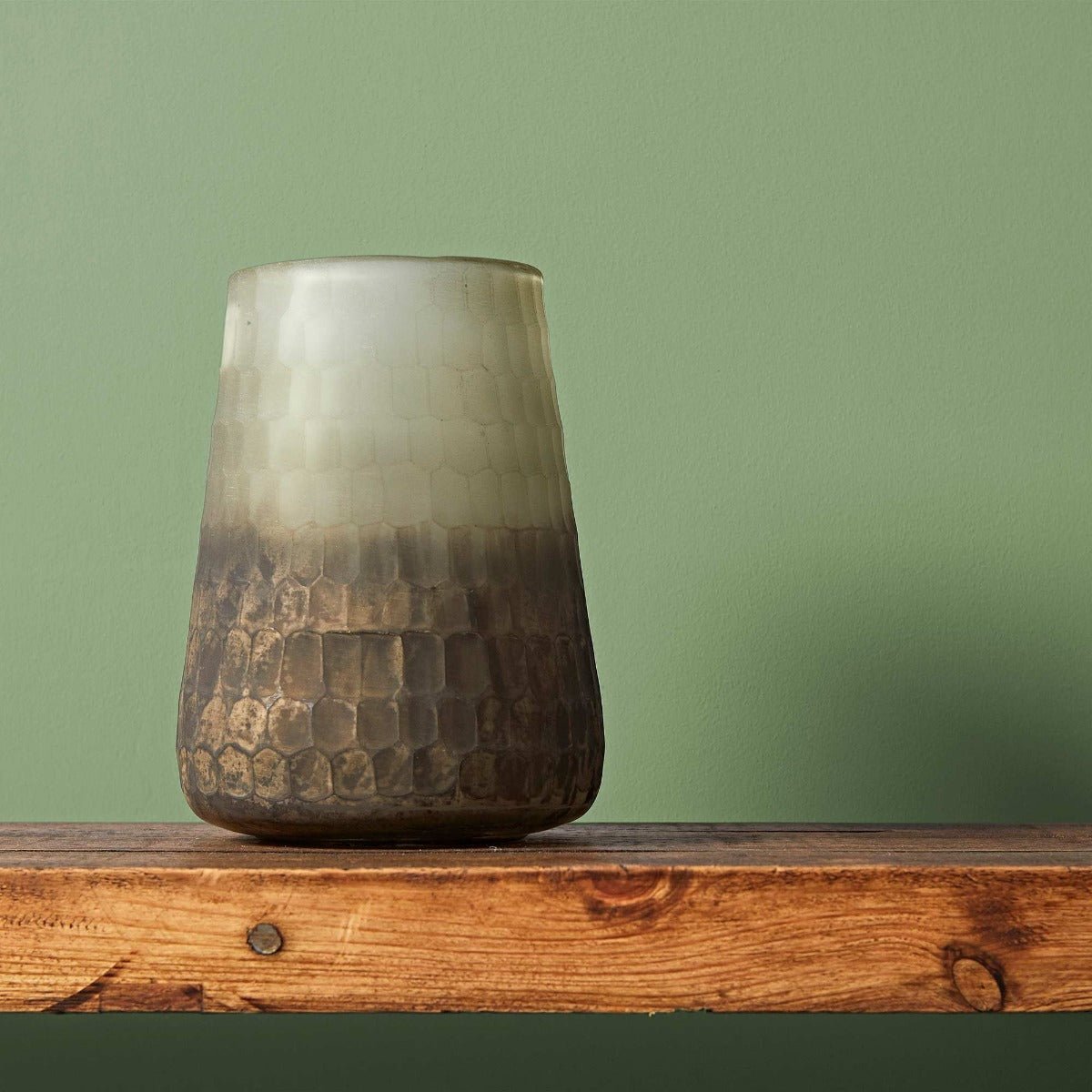 Garnet ceramic vase with a gradient light gray to dark brown finish and a textured hammered pattern on the lower half