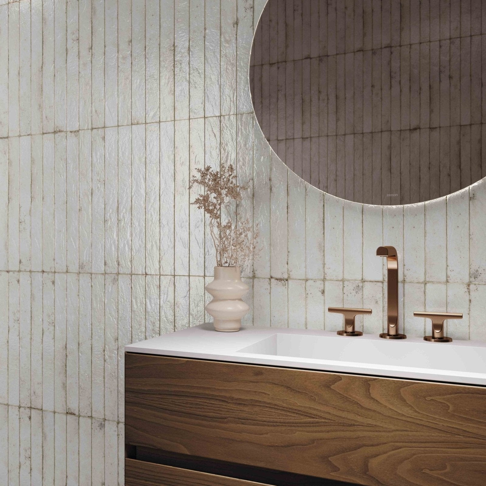 A sleek white ceramic vase genesi white brillo with a tiered sculptural design on a vanity