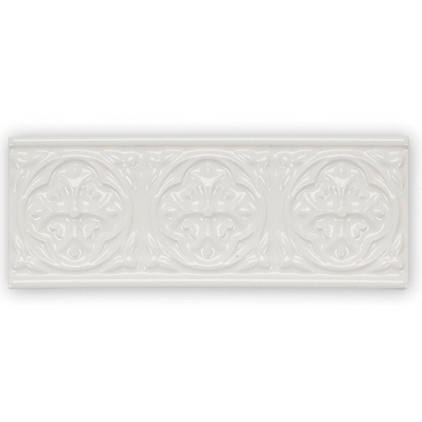 White ceramic tile giralda cascara cream border with three embossed floral medallions in a row