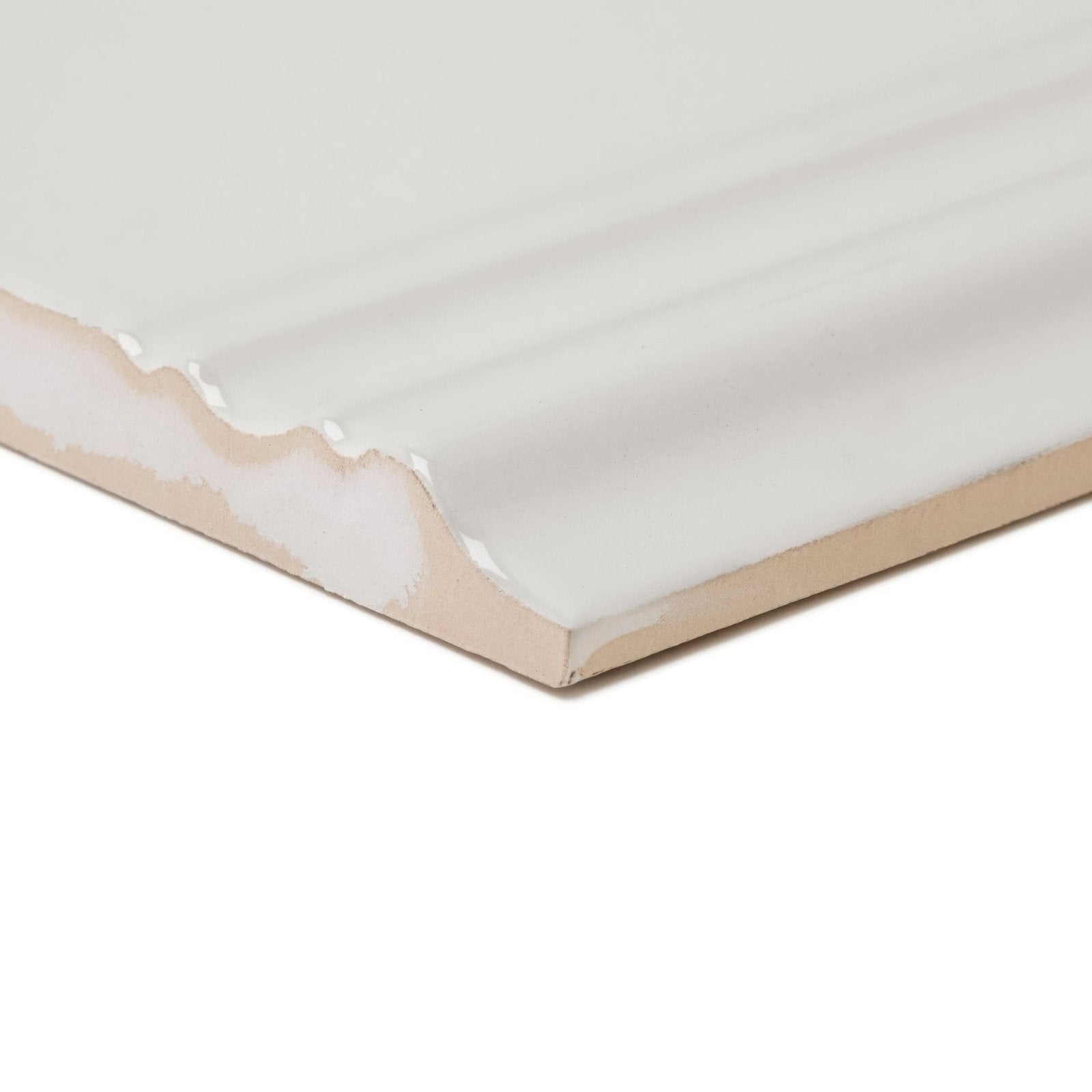 Off-white ceramic giralda cascara cream skirting with a smooth glossy finish and subtle ridged texture