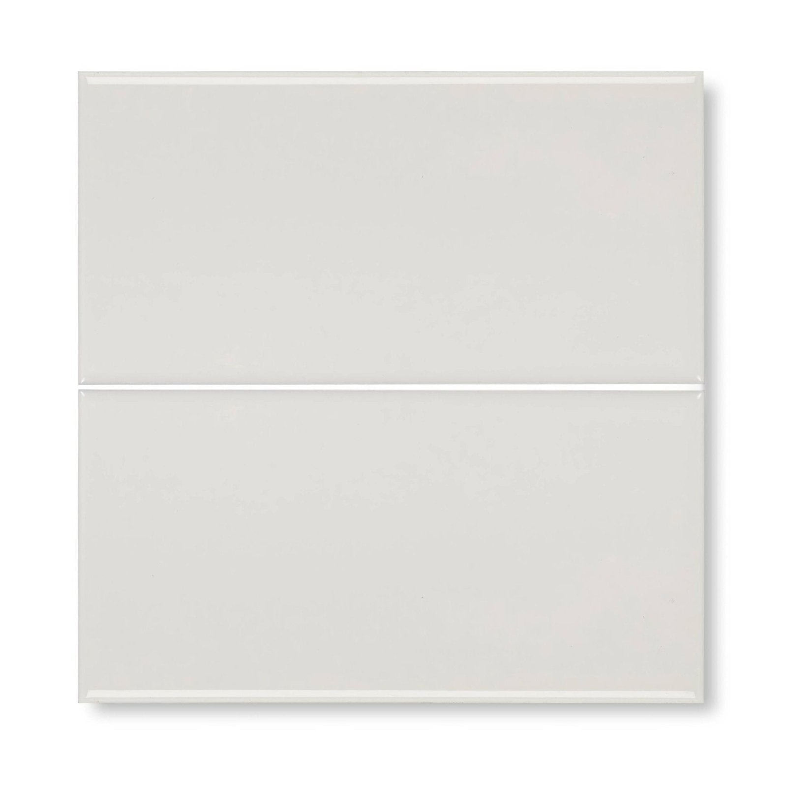 Two glossy white rectangular glass tiles stacked vertically from Giralda cascara cream tile collection