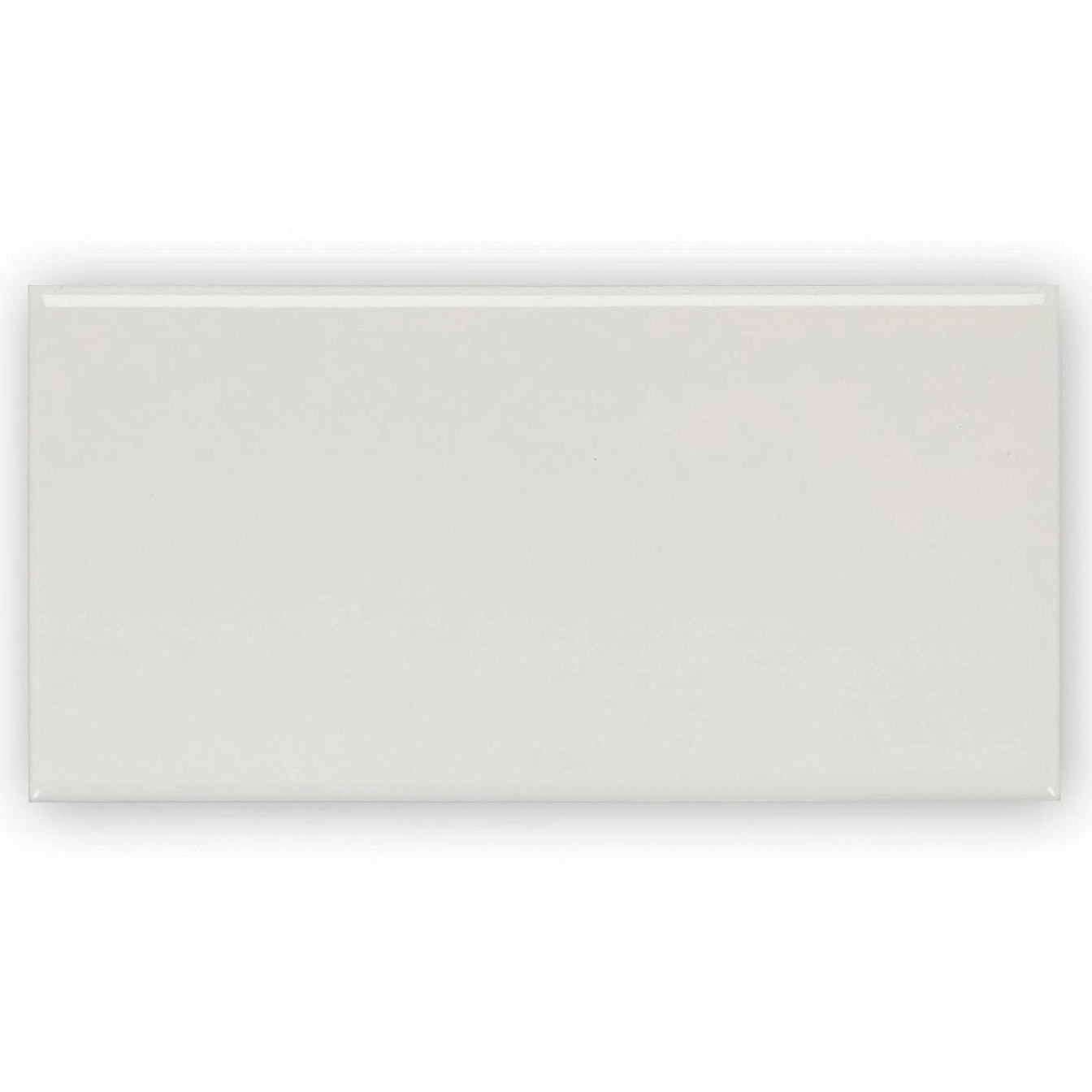 A sleek rectangular white ceramic tile with a smooth glossy finish giralda cascara cream tile