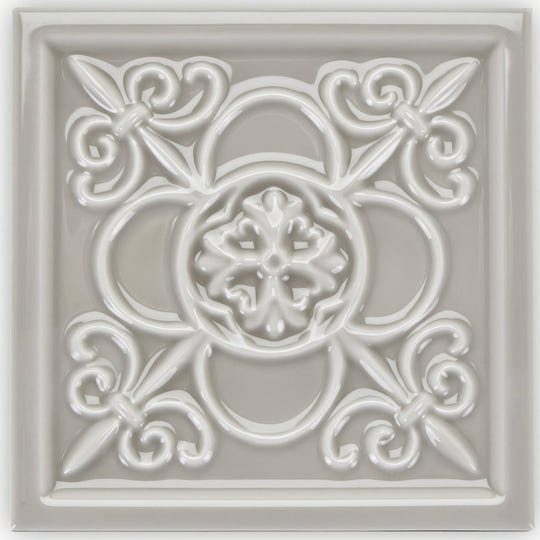 Giralda Niebla Grey off-white ceramic decor tile with ornate raised floral and scrollwork design