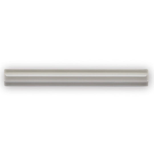 A sleek matte gray ceramic tile giralda niebla grey pencil with subtle glossy finish and two parallel grooves