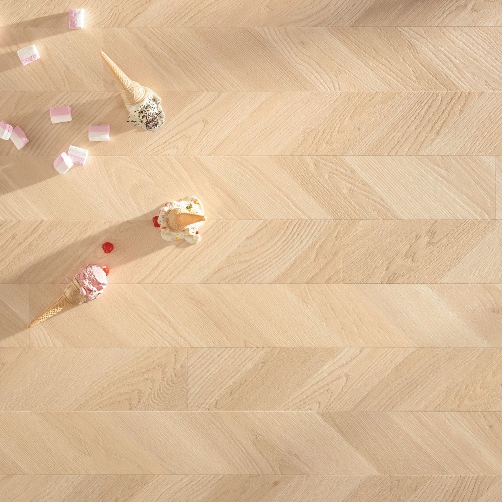 Light-colored wood vinyl flooring with herringbone pattern in gizeh f400 vinyl twist design
