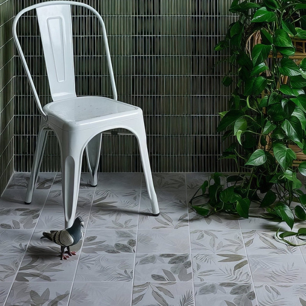 White metal chair with minimalist design and curved backrest from glass house porcelain product line