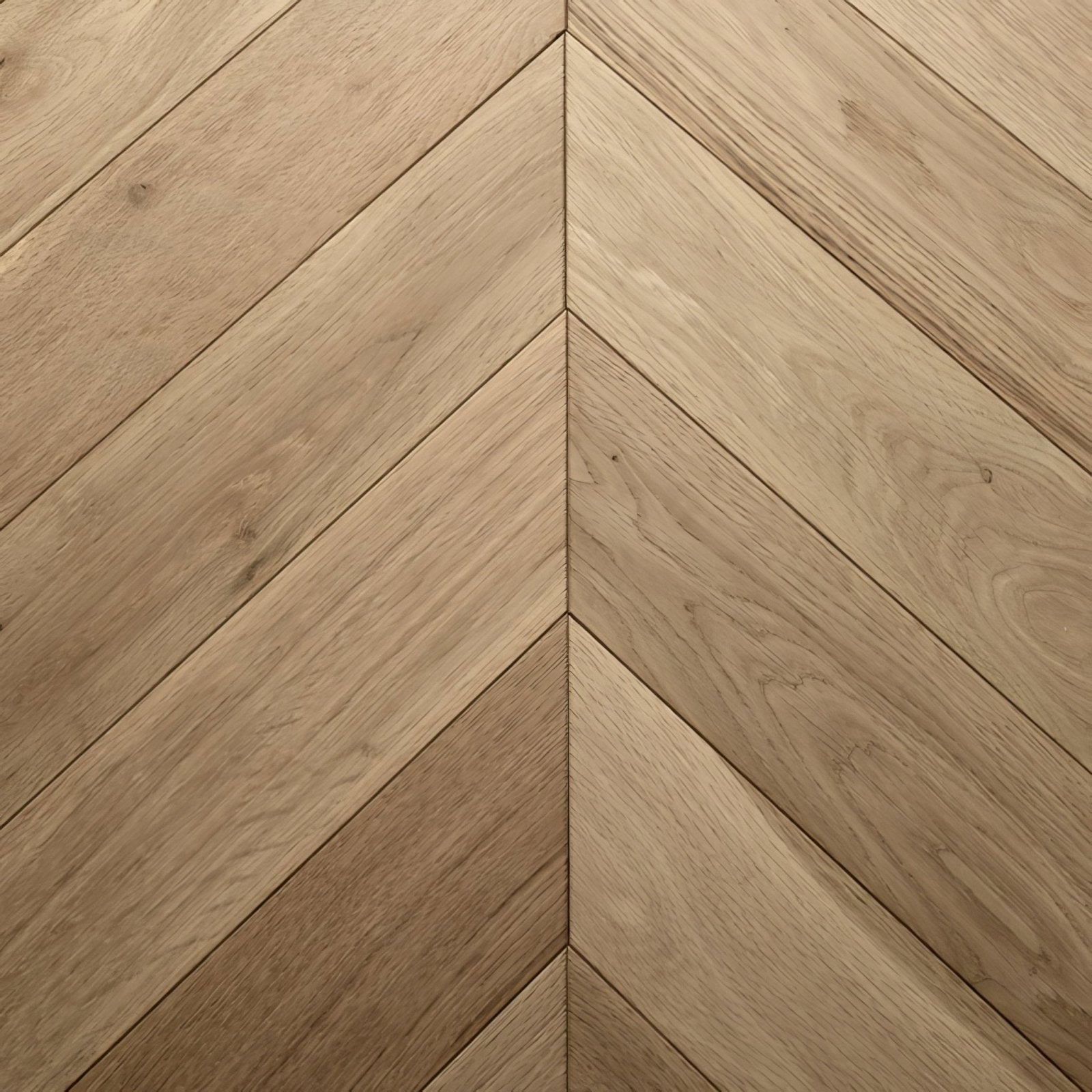 Light oak colored hardwood flooring in a chevron herringbone pattern from goodrich raw oak collection