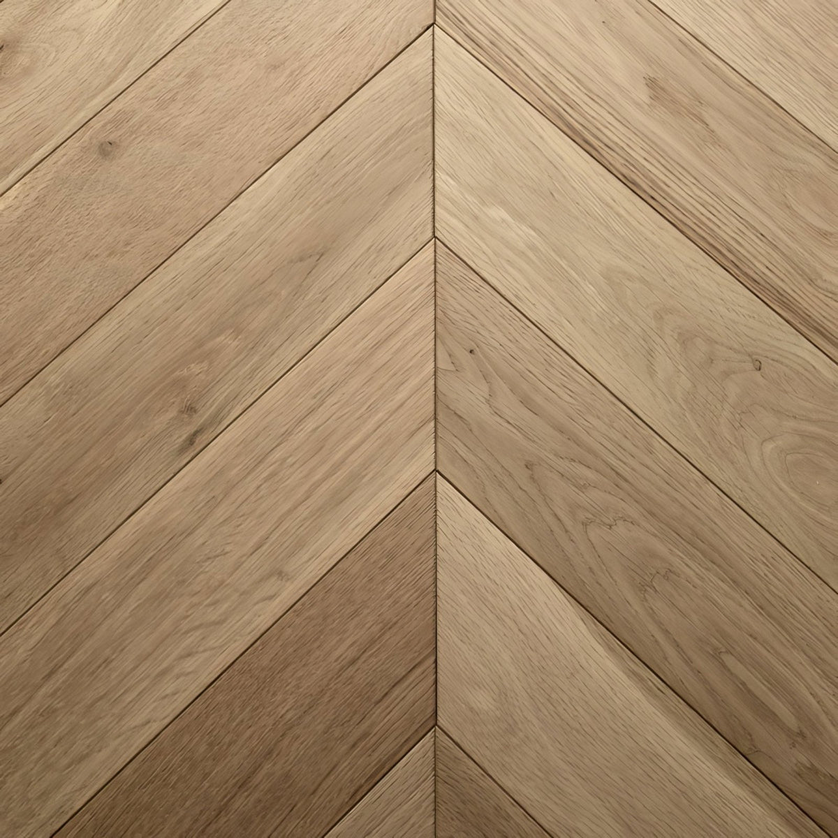 Light oak colored hardwood flooring in a chevron herringbone pattern from goodrich raw oak collection