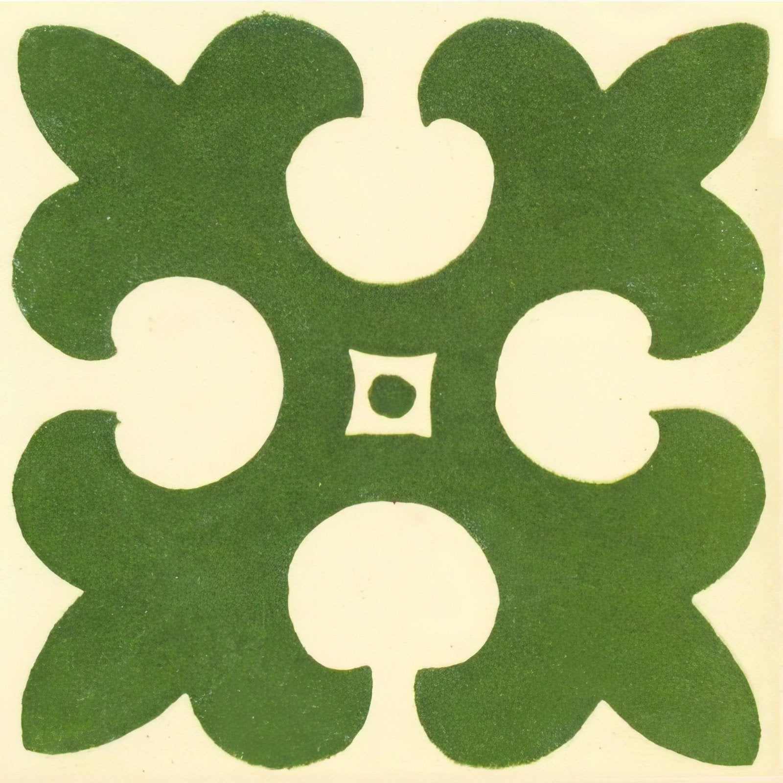 Green quatrefoil ceramic tile named gordon pale green on white with cream cutouts and central square detail