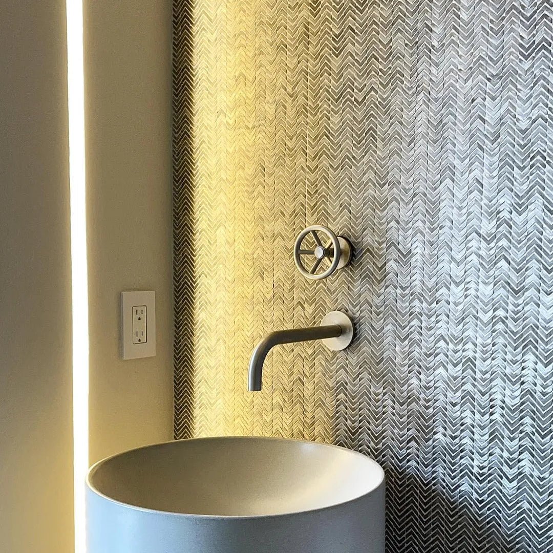 Gravity Aluminium Arrow Metal Mosaic grey chevron aluminium mosaic with a matte grey vessel sink and tap
