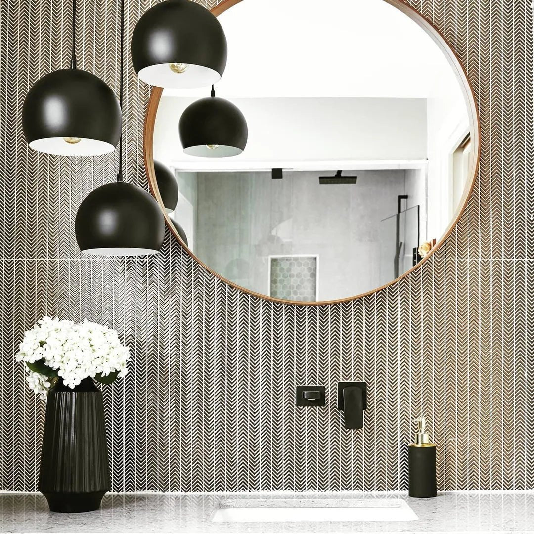 Gravity Aluminium Arrow Metal Mosaic grey chevron aluminium mosaic with a black ribbed vase of white flowers