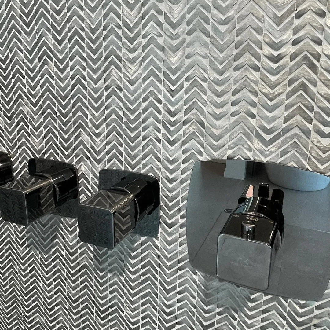 Gravity Aluminium Arrow Metal Mosaic grey chevron aluminium mosaic with a black chrome shower tap