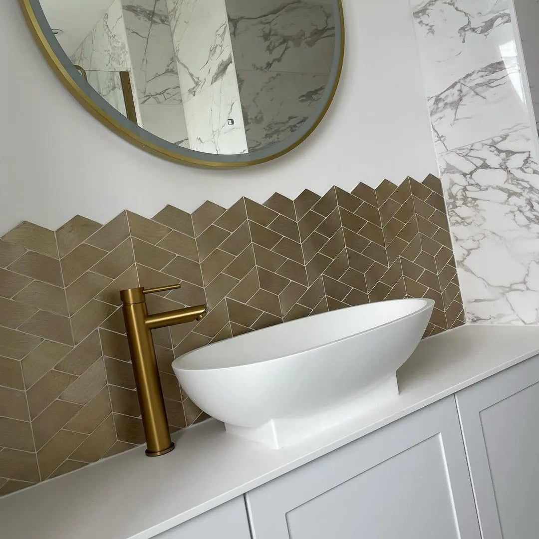 Gravity Aluminium Trace Gold Mosaic gold chevron aluminium mosaic with a white oval vessel sink