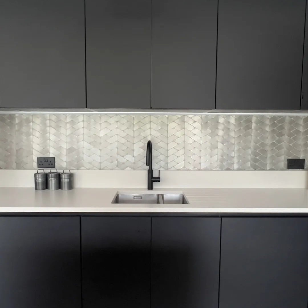 Gravity Aluminium Trace Metal Mosaic silver chevron aluminium mosaic with a black tap and stainless steel sink