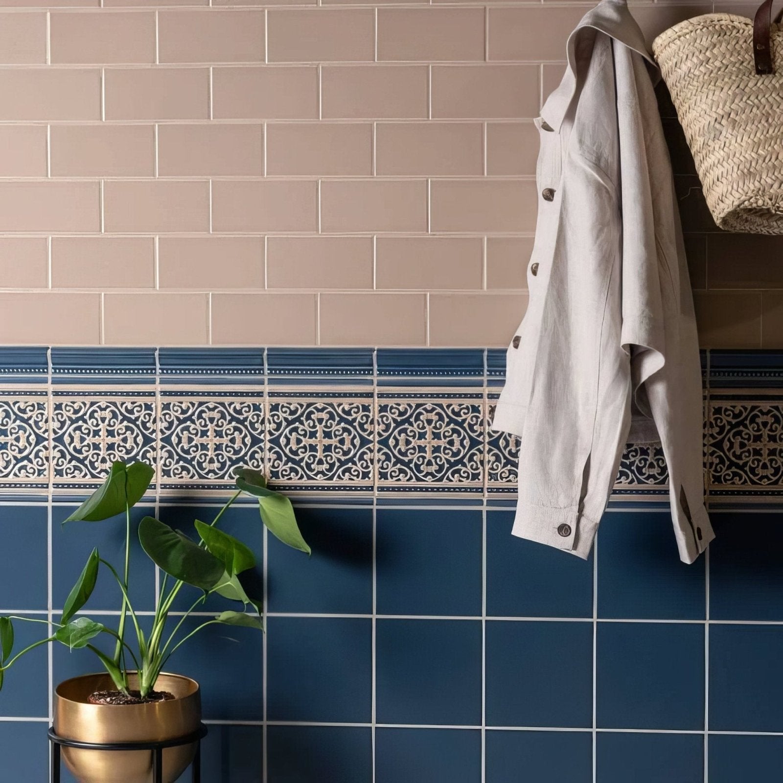 Blue and white patterned ceramic tile border with intricate geometric designs from grosvenor palladian beige on ascot blue