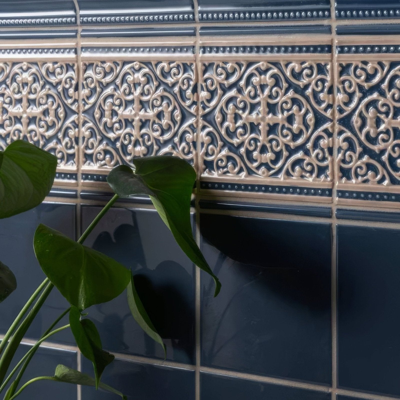 Dark blue ceramic grosvenor palladian beige tiles with cream ornamental patterns and beveled edges on ascot blue background