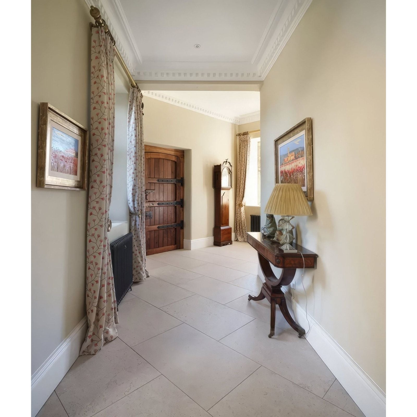 Dark wood wychwood limestone velvet finish console table with curved legs topped by ornate lamp with beige shade