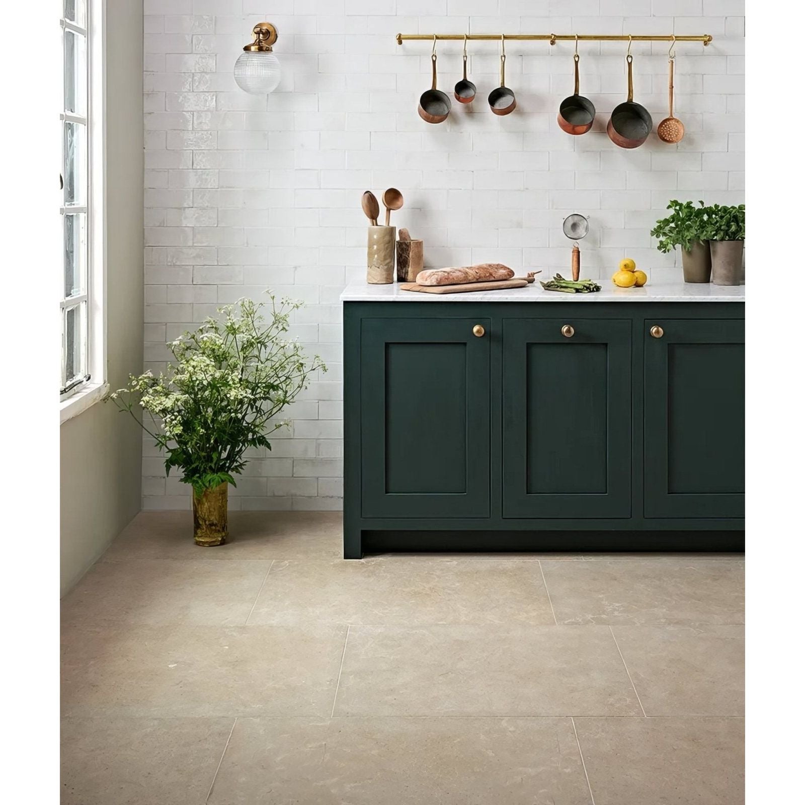 Dark green wychwood limestone velvet finish kitchen cabinet with gold toned knobs and white countertop