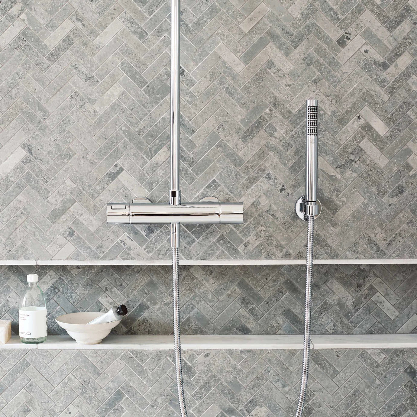 Hampton Bays 10 x 30cm Honed grey stone-effect tiles with a chrome shower system