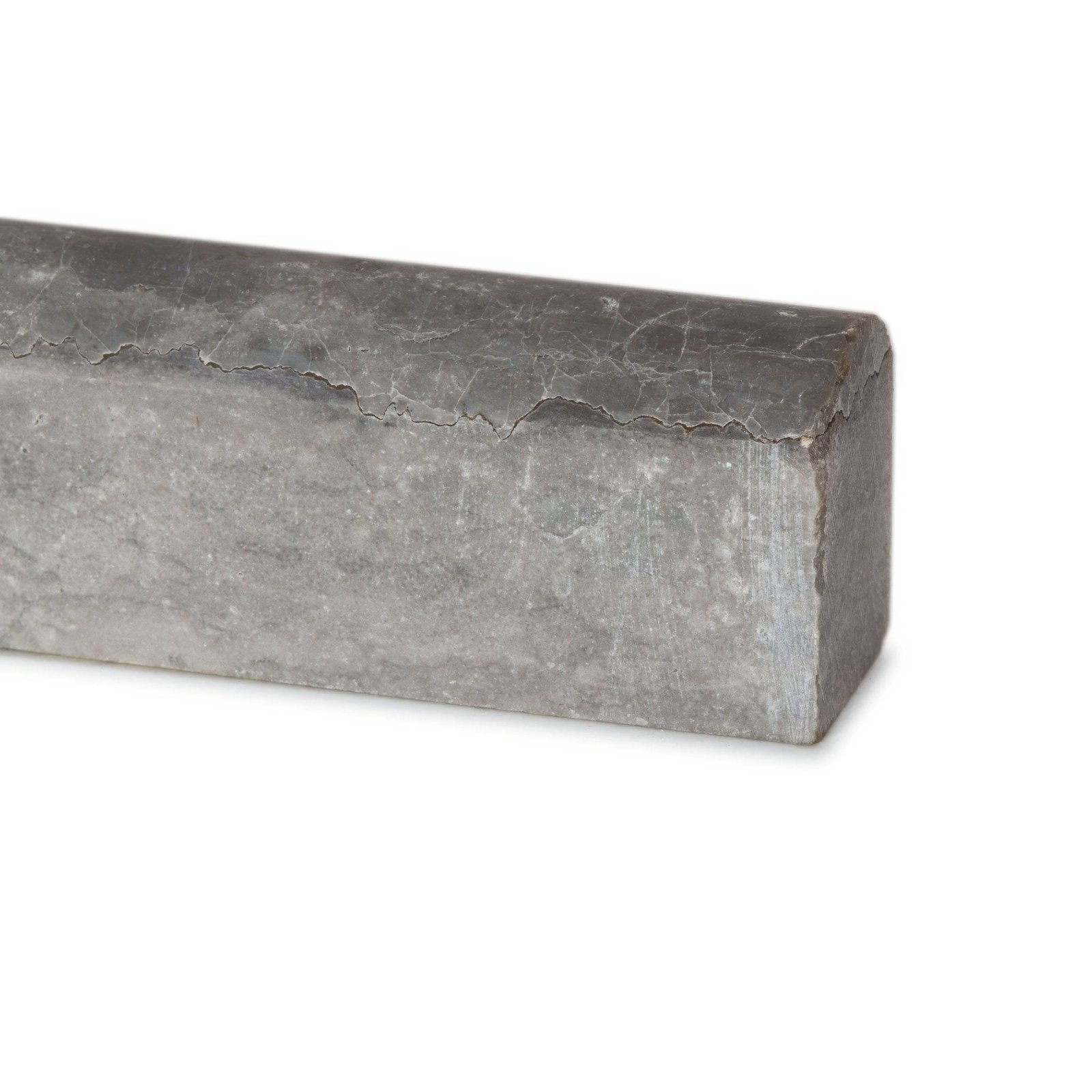 A rectangular gray metal hampton bays pencil bar with a rough slightly cracked textured surface