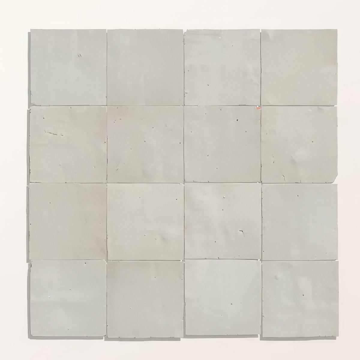Grid of light gray tiles on a white background