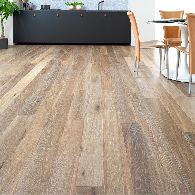 Warm-toned harlech white smoked oak laminate flooring with natural wood grain and subtle color and texture variations