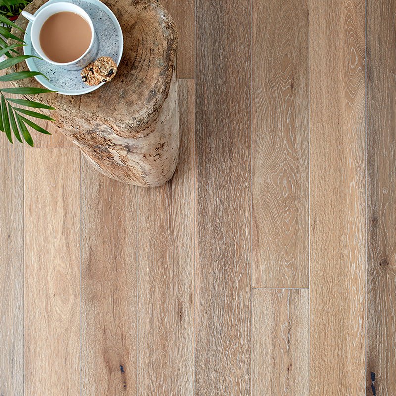 Light brown hardwood floor with natural wood grain pattern in Harlech white smoked oak material