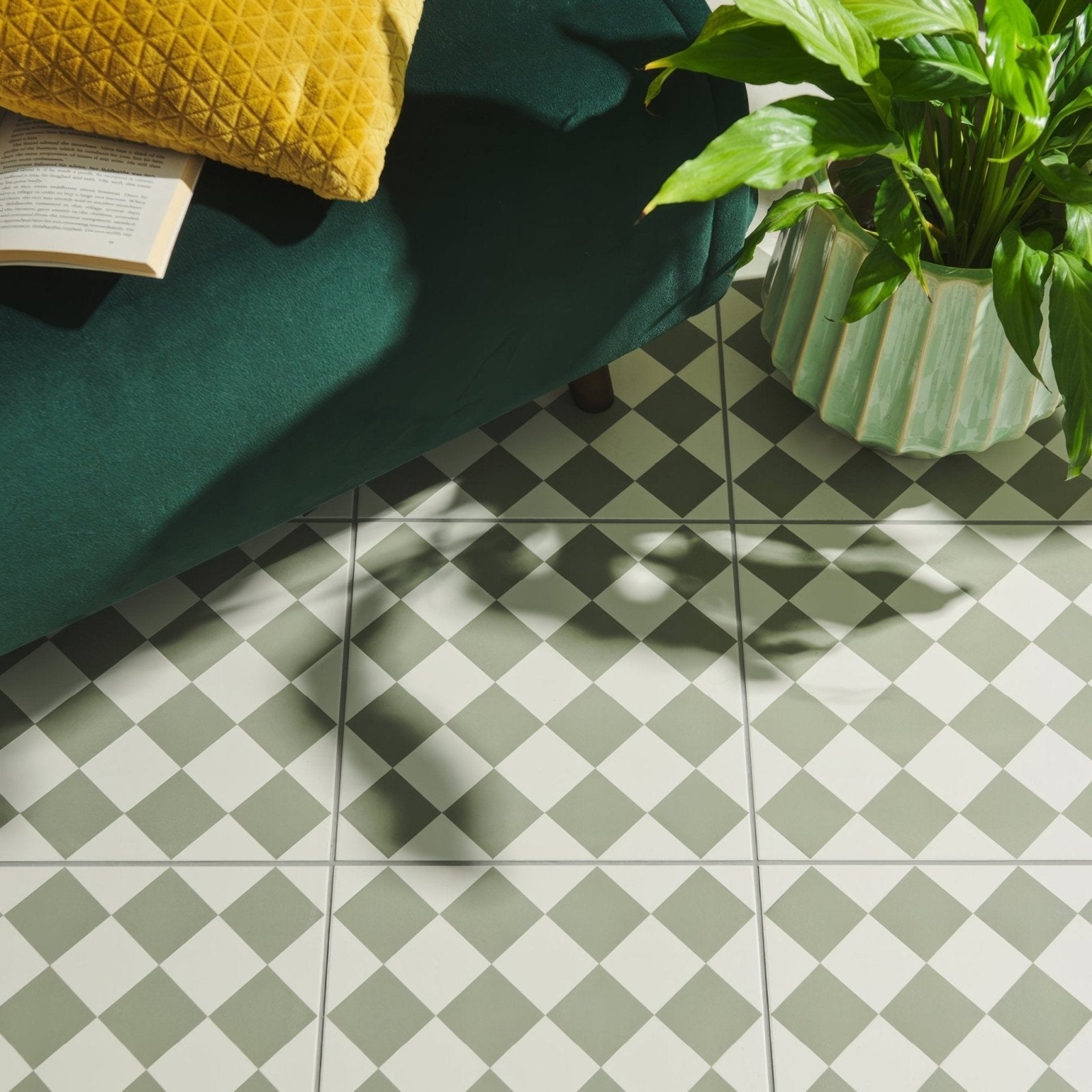 Harlequin small green on chalk floor tiles featuring green and white checkered pattern with subtle matte finish