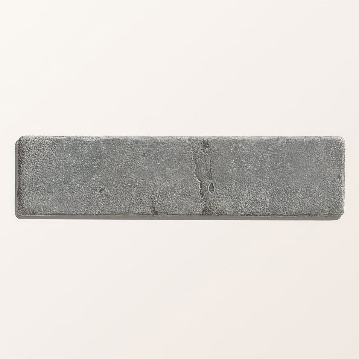 Hazlebury limestone tumbled and etched klinkers in gray with a textured speckled surface and natural veining