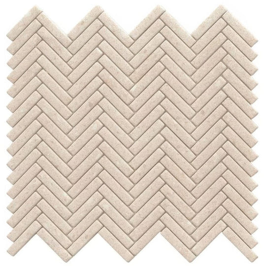 Beige stone mosaic tile in herringbone pattern called herringbone durango bone mosaic for wall and floor use