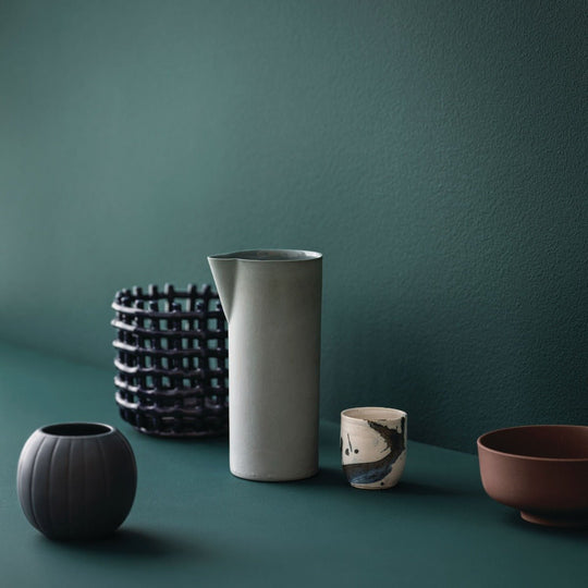 A minimalist white ceramic pitcher hesper with a smooth matte finish and a subtle spout for easy pouring