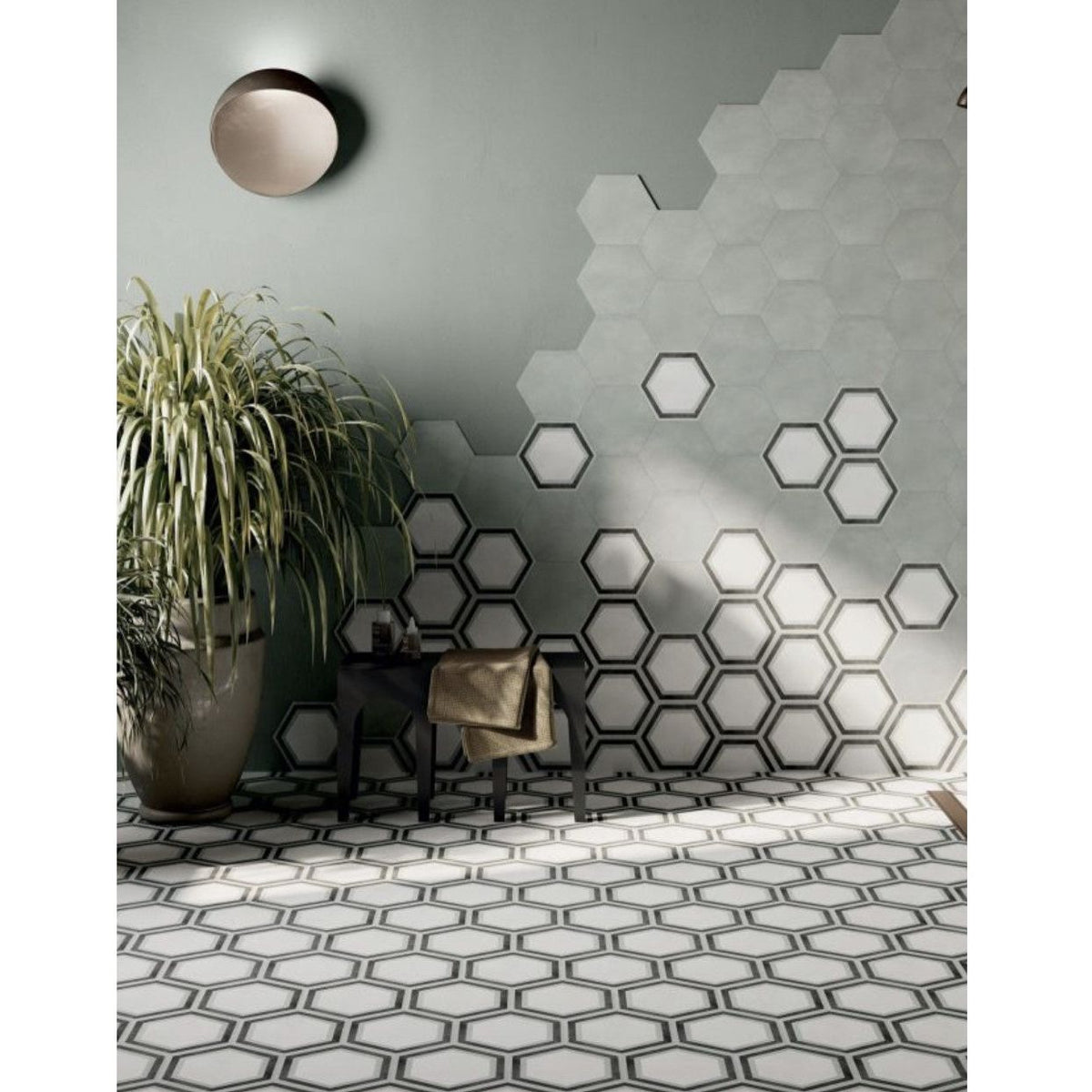 Hexagon white framed wall tiles with black outlines in a modern hexagonal pattern on white and gray surfaces