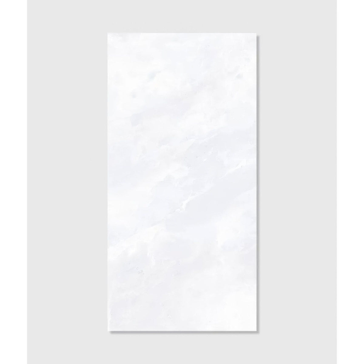 A sleek rectangular white marble Himalaya porcelain matt crystal tile with subtle veining and a glossy finish