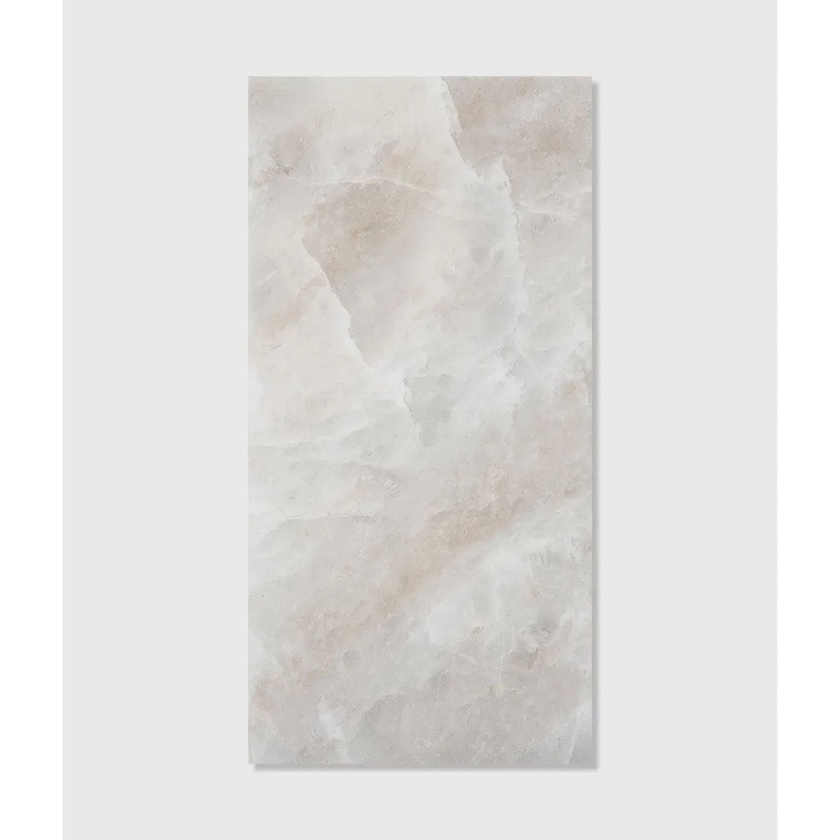 A rectangular light beige marble tile with subtle veining and smooth polished surface from himalaya porcelain matt natural