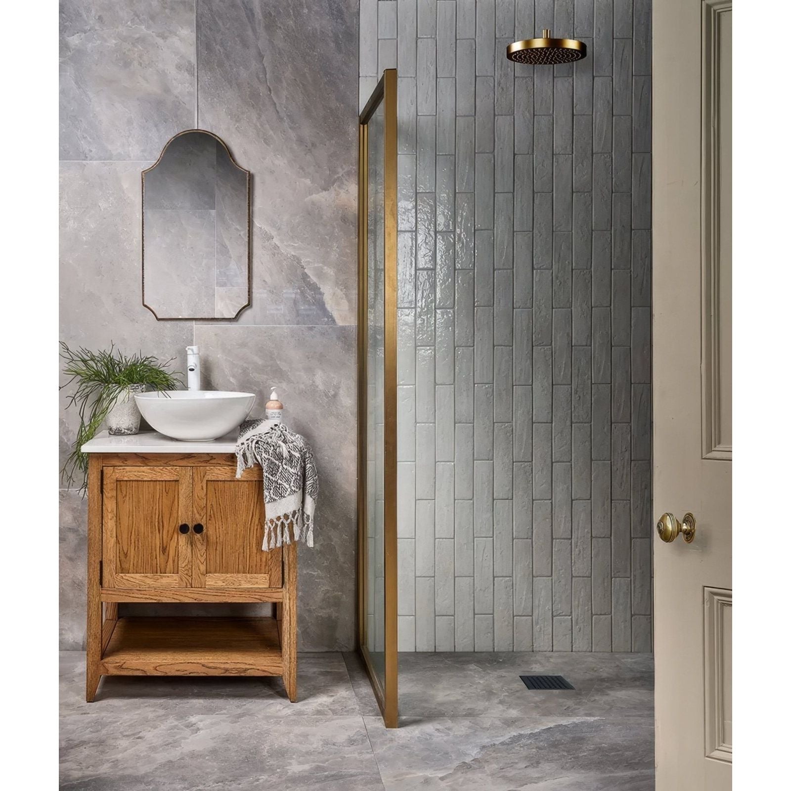 A sleek gold-toned circular showerhead with textured surface from the Himalaya porcelain matt sunset collection
