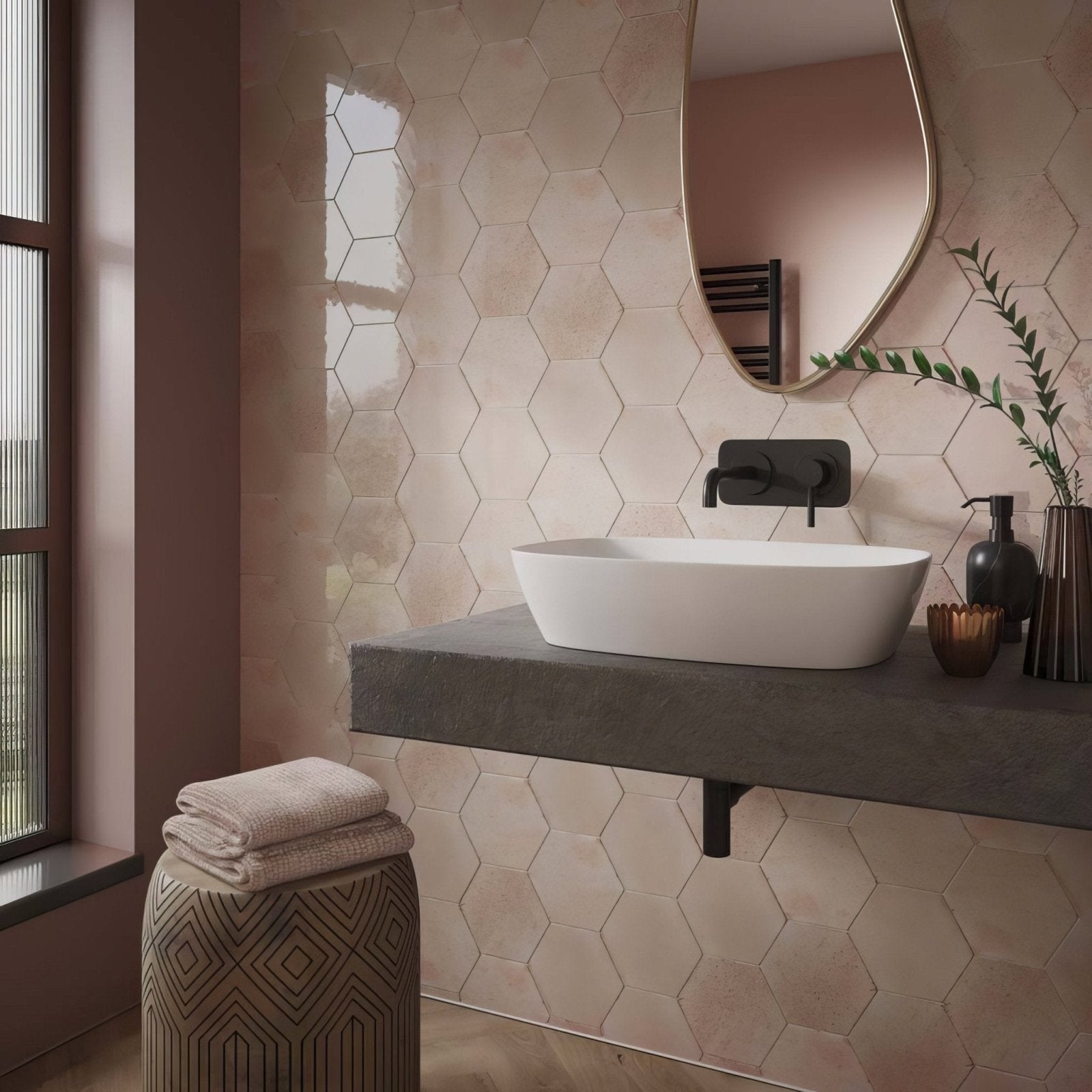White ceramic vessel sink with sleek modern design on dark gray concrete countertop in hope rose hexagon gloss ceramic wall setting