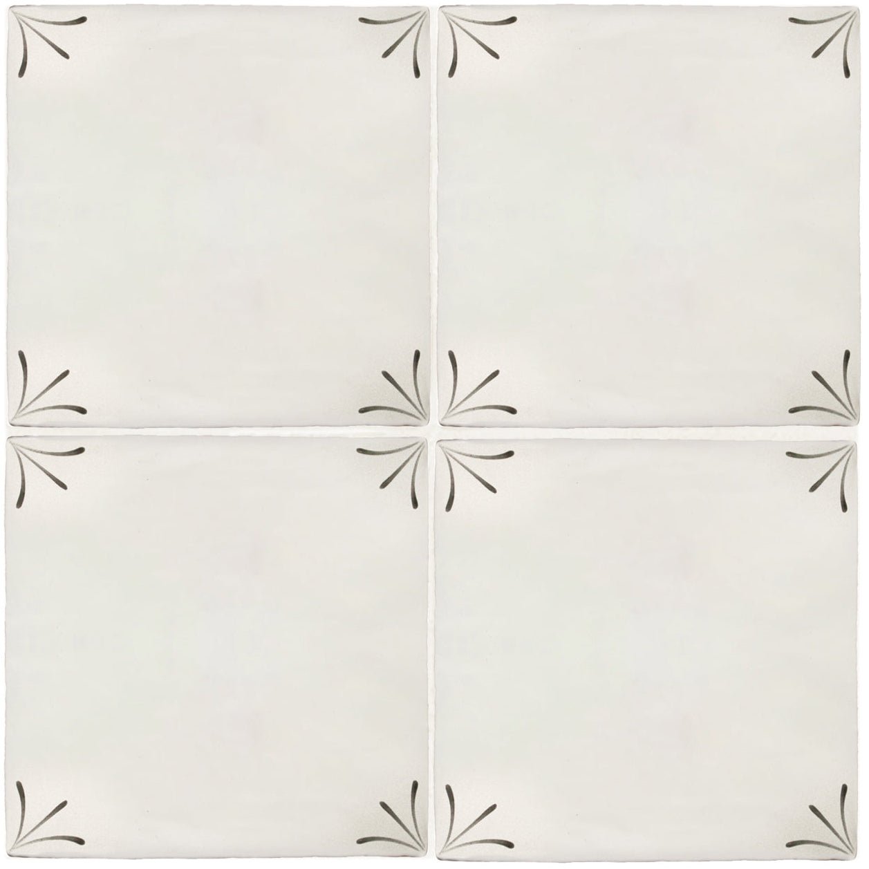 Off-white ceramic tiles with black hand-painted leaf motifs at each corner from imprint delft corners collection