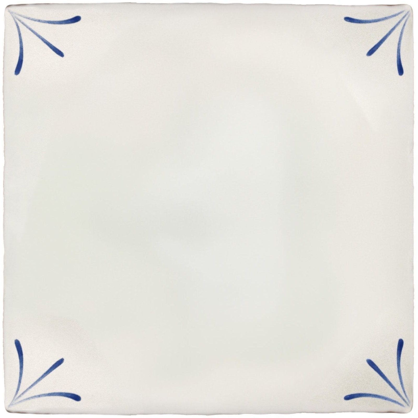 Cream-colored ceramic tile with delicate blue floral motifs in each corner from imprint delft corners collection