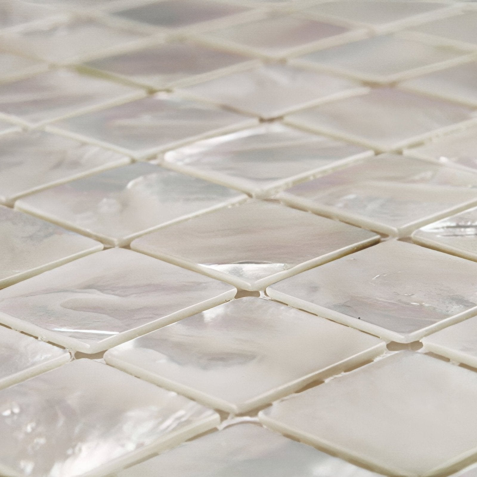 Square iridescent white mother-of-pearl mosaic tiles with a glossy finish from Innocence 25mm square collection