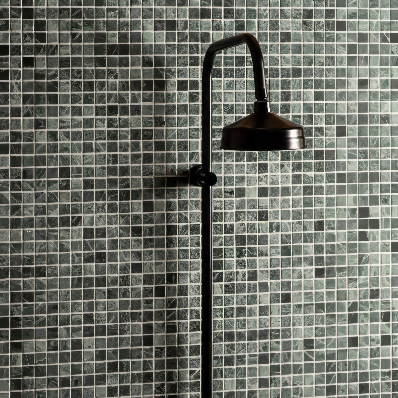 Jade 2.3 Venetian Stone Mosaic green marble mosaic with a black matte showerhead